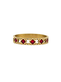 Gold bracelet with red gemstones on a white background