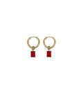 Gold hoop earrings with red rectangular charms on a white background